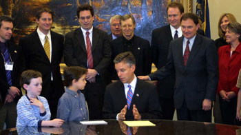 Photo: Governor Jon Huntsman signs home-education reform into law